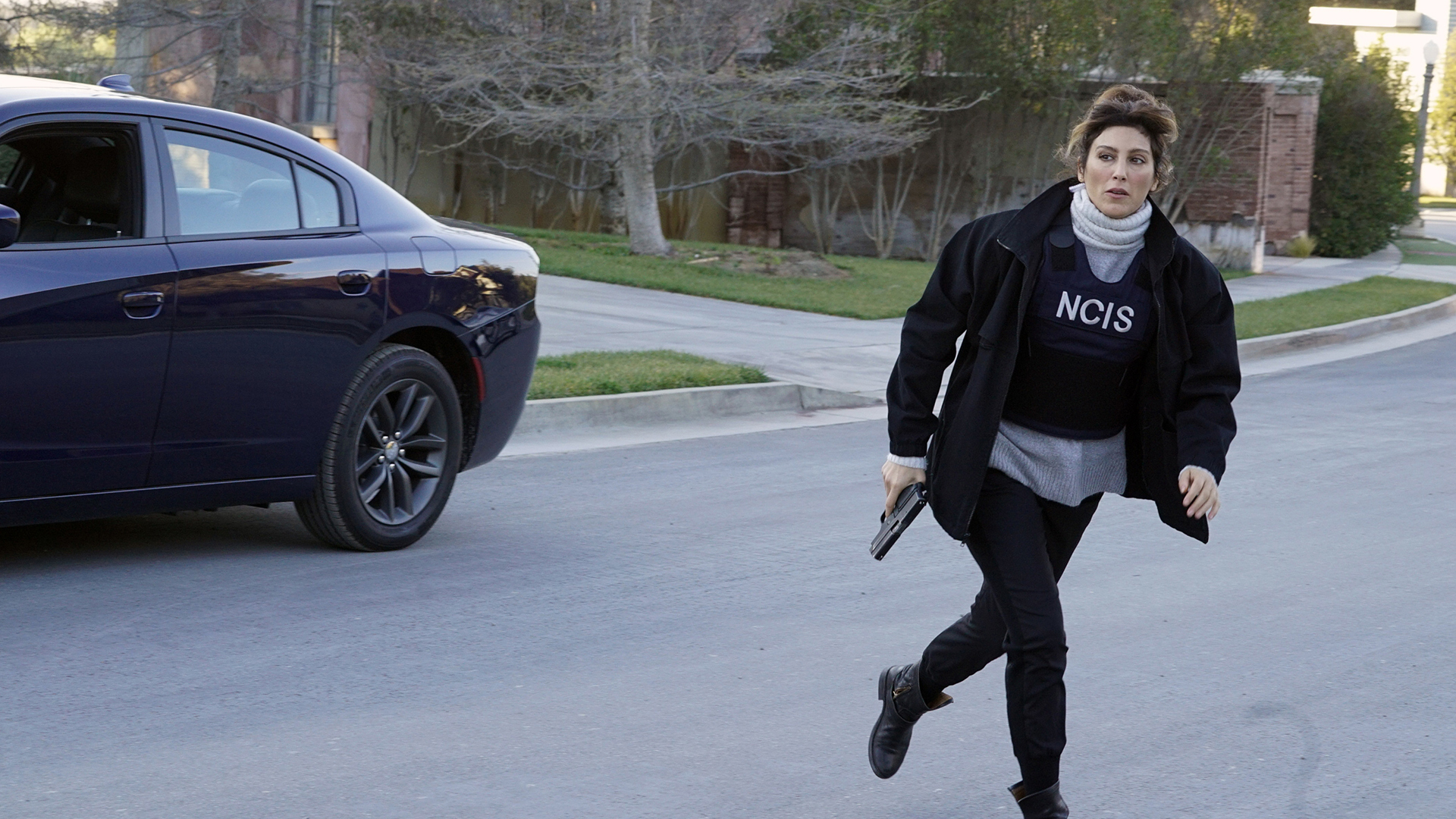 Quinn bolts across the street.