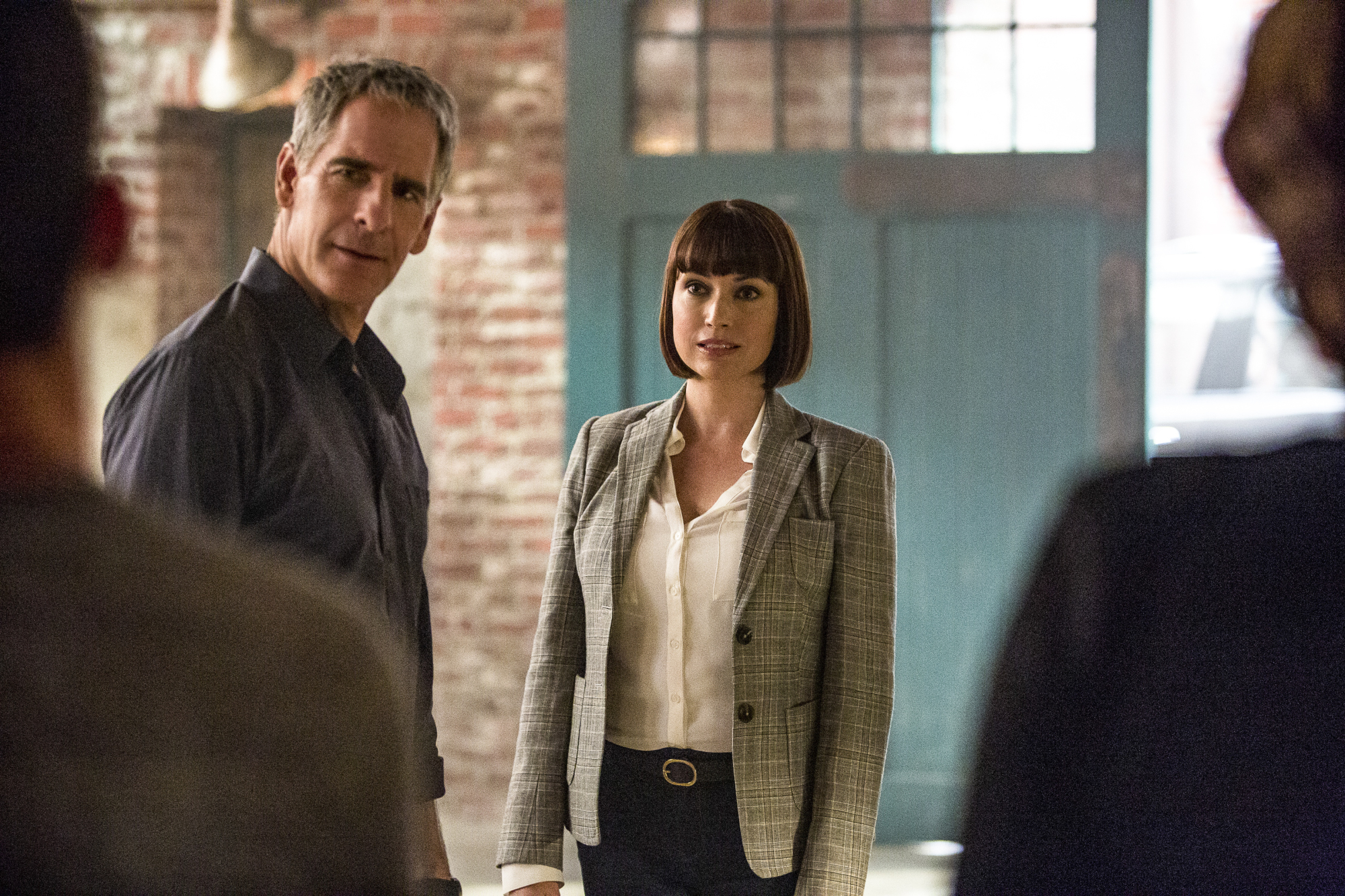 Scott Bakula as Special Agent Dwayne Pride and Julie Ann Emery as NCIS Special Agent Karen Hardy