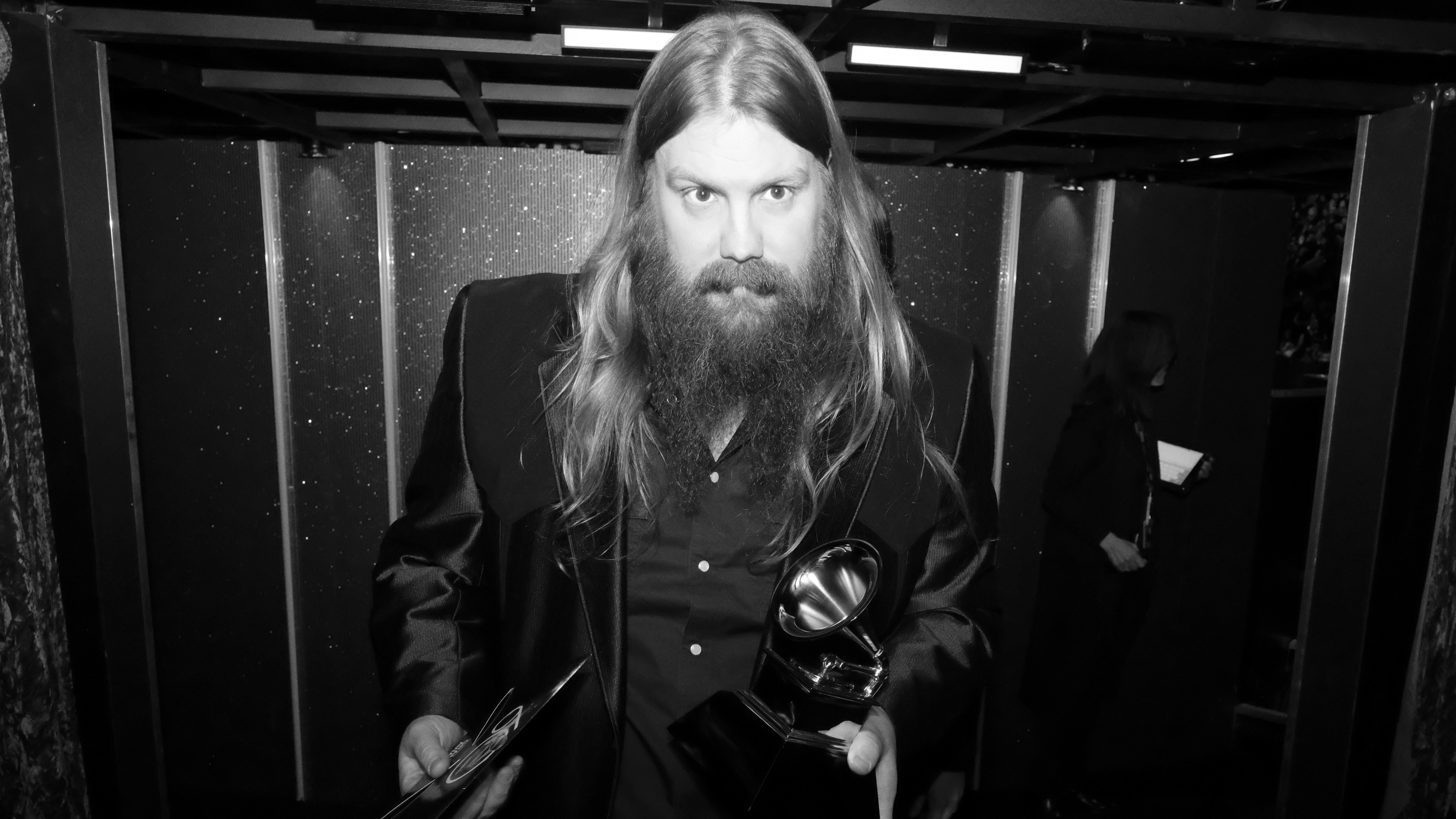 Chris Stapleton, who earned three 2018 GRAMMY trophies, holds his Best Country Album award backstage.