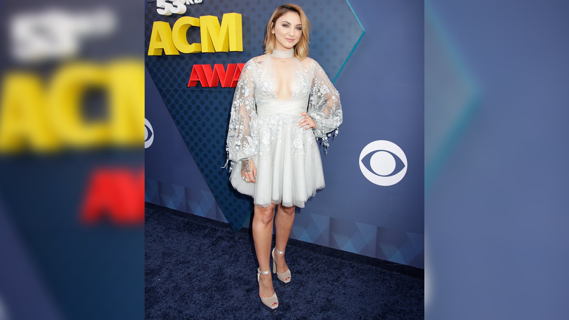 Pop singer Julia Michaels floats down the ACM red carpet before performing 