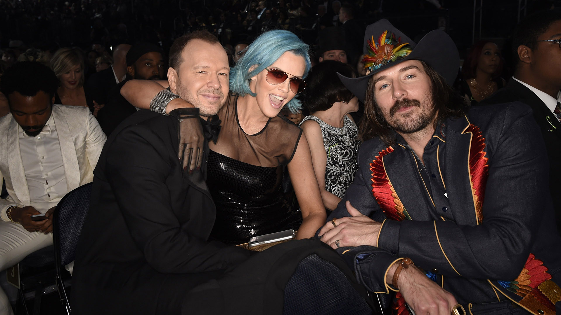 Blue Bloods star Donnie Wahlberg and his wife Jenny McCarthy strike a pose with Mark Wystrach from Midland.