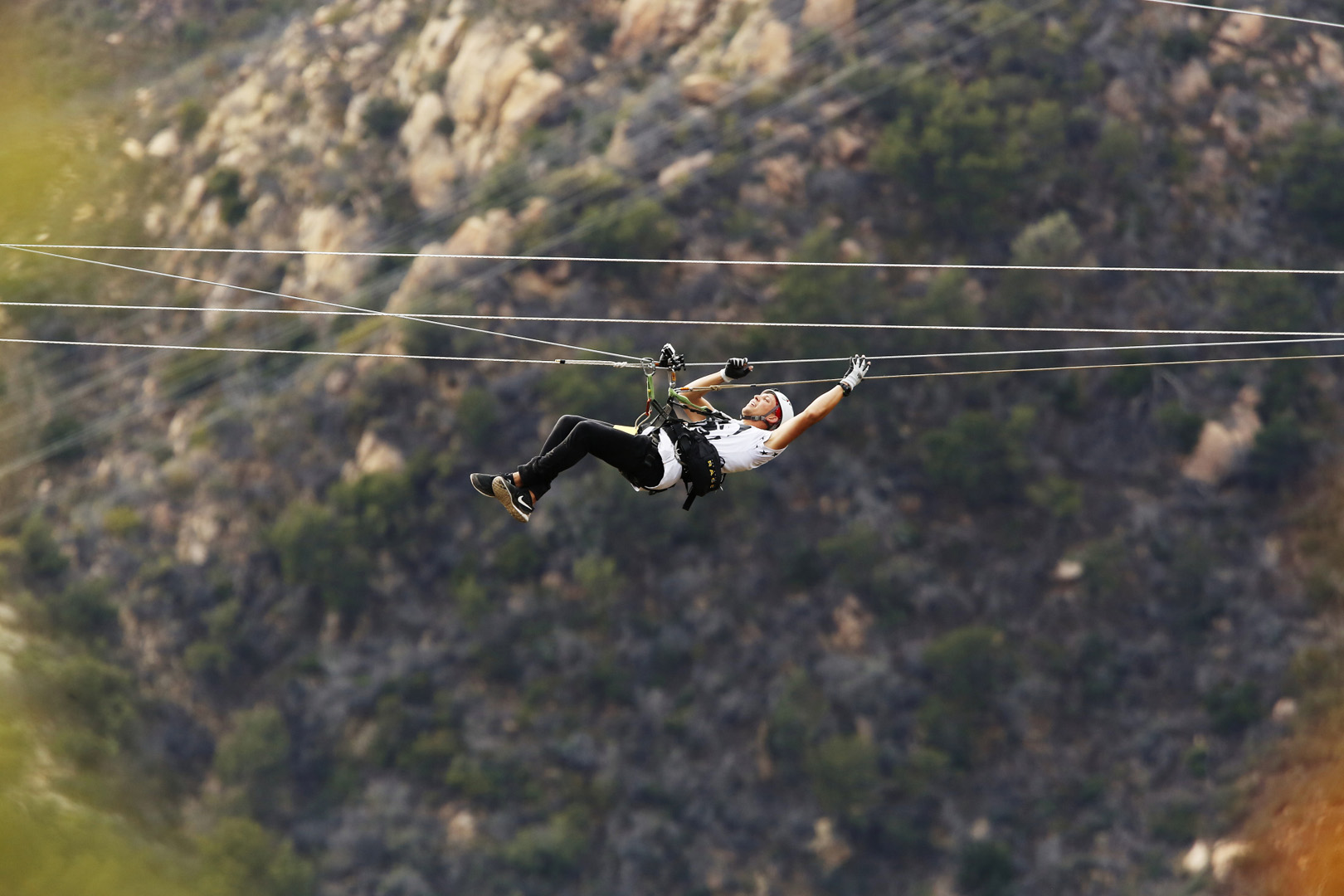 Matt hangs in midair from her zip line.
