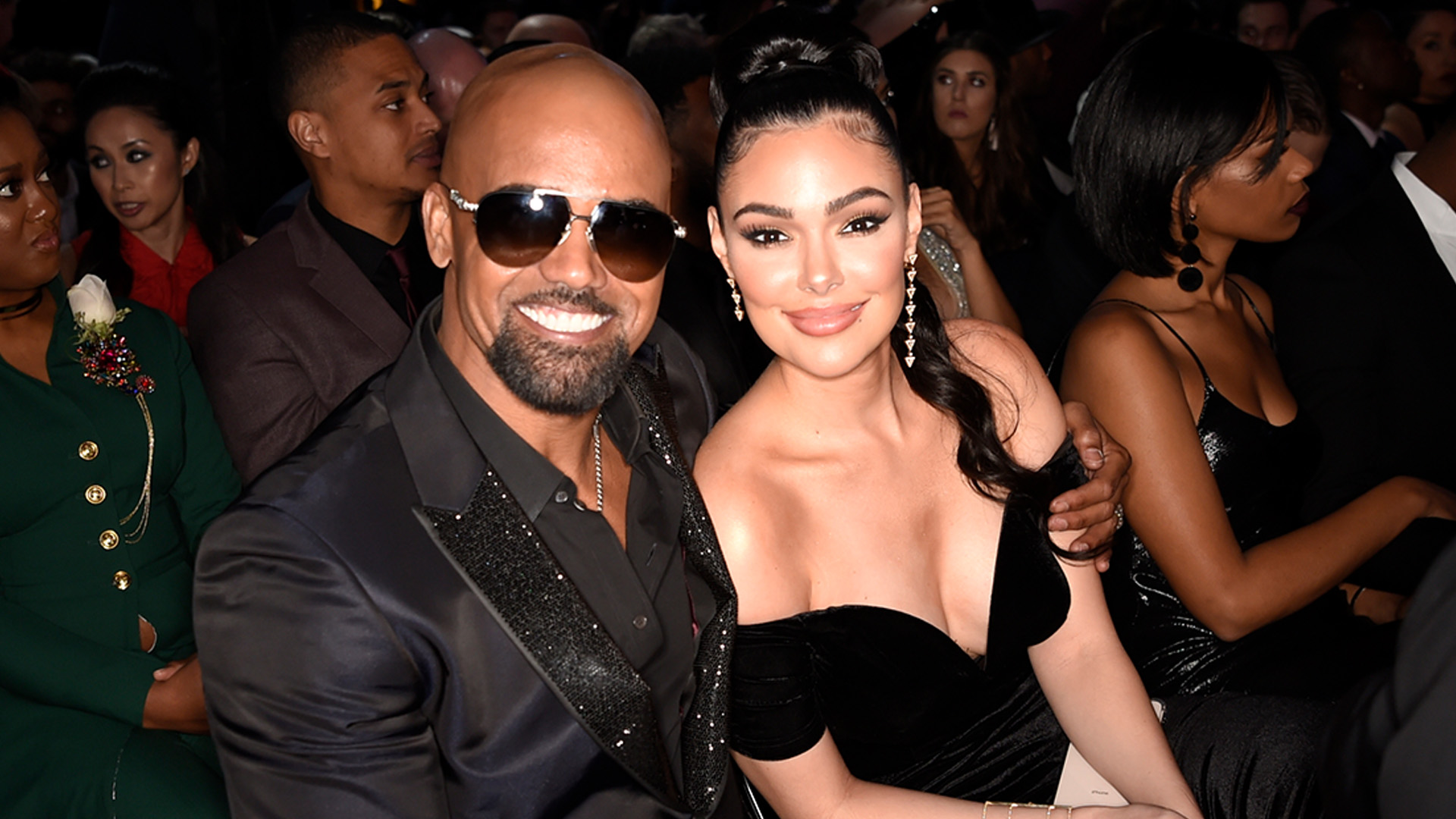 S.W.A.T. star and GRAMMY presenter Shemar Moore throws an arm around his co-star Lina Esco.