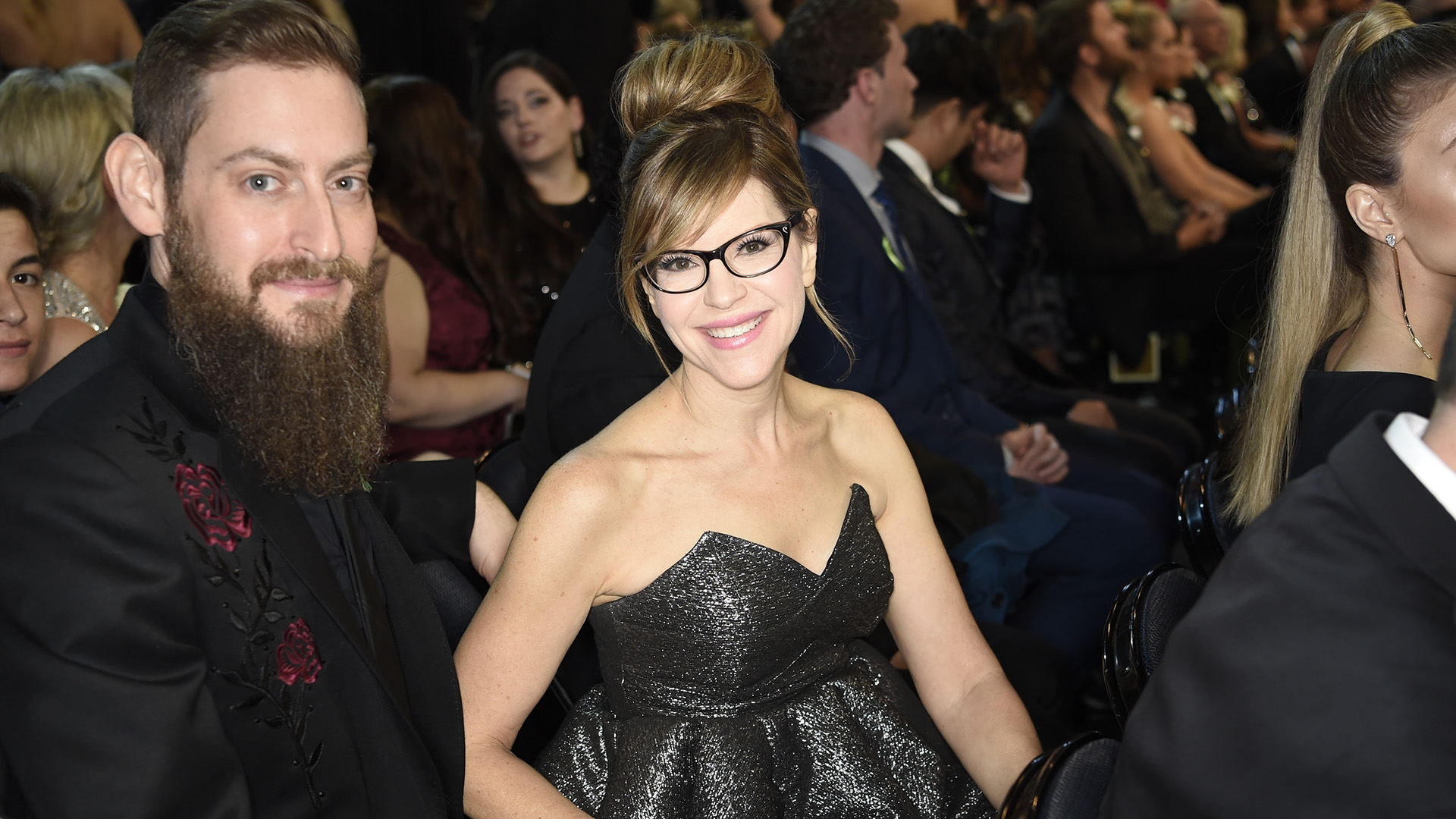 Lisa Loeb, who took home a 2018 GRAMMY for Best Children's Album, smiles alongside her husband, Roey Hershkovitz.