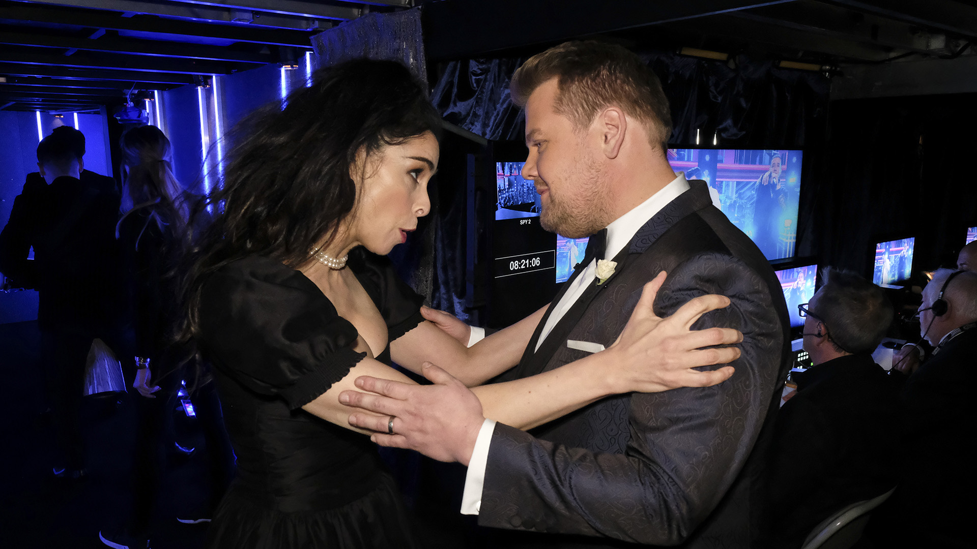 Comedian and Best Comedy Album nominee Sarah Silverman clutches host James Corden by the shoulders backstage at Madison Square Garden.