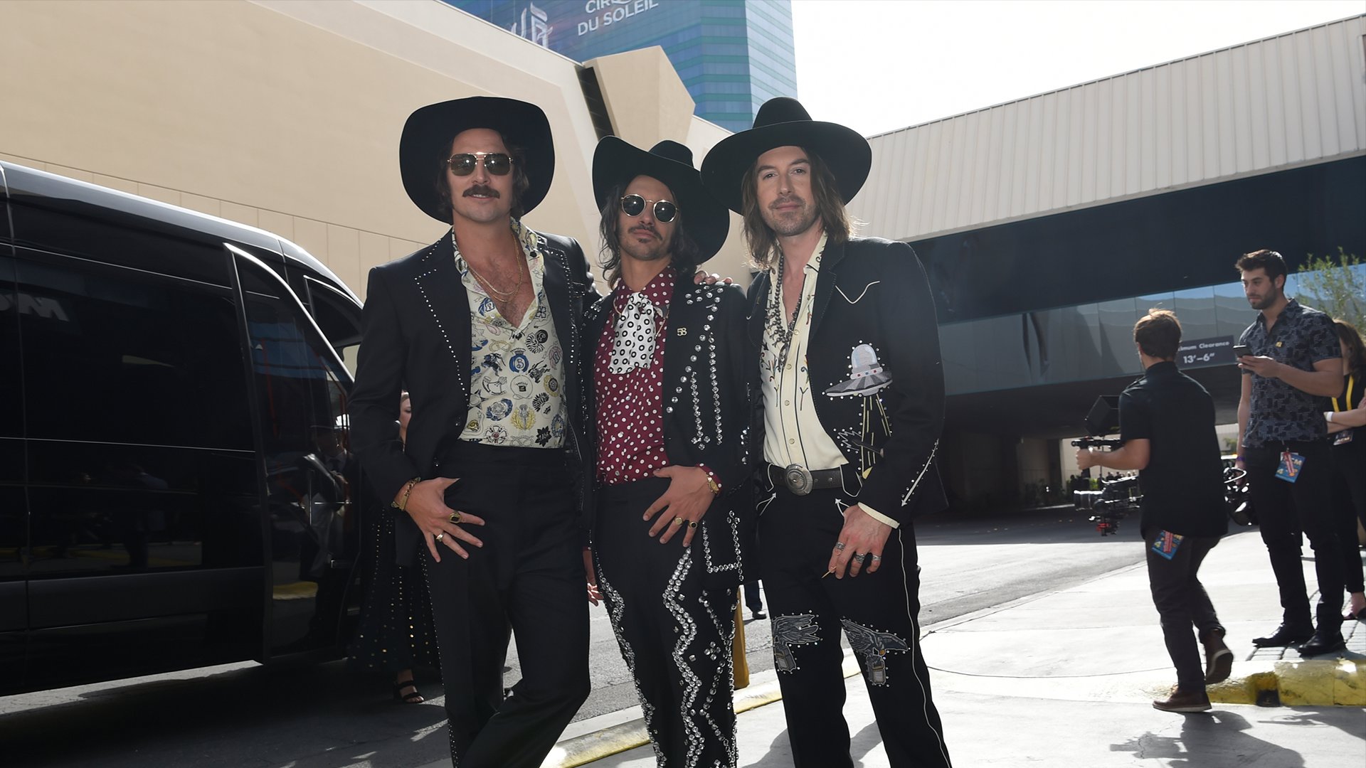 Midland, winner of New Vocal Duo or Group of the Year, wear matching cowboy hats on the ACM red carpet.