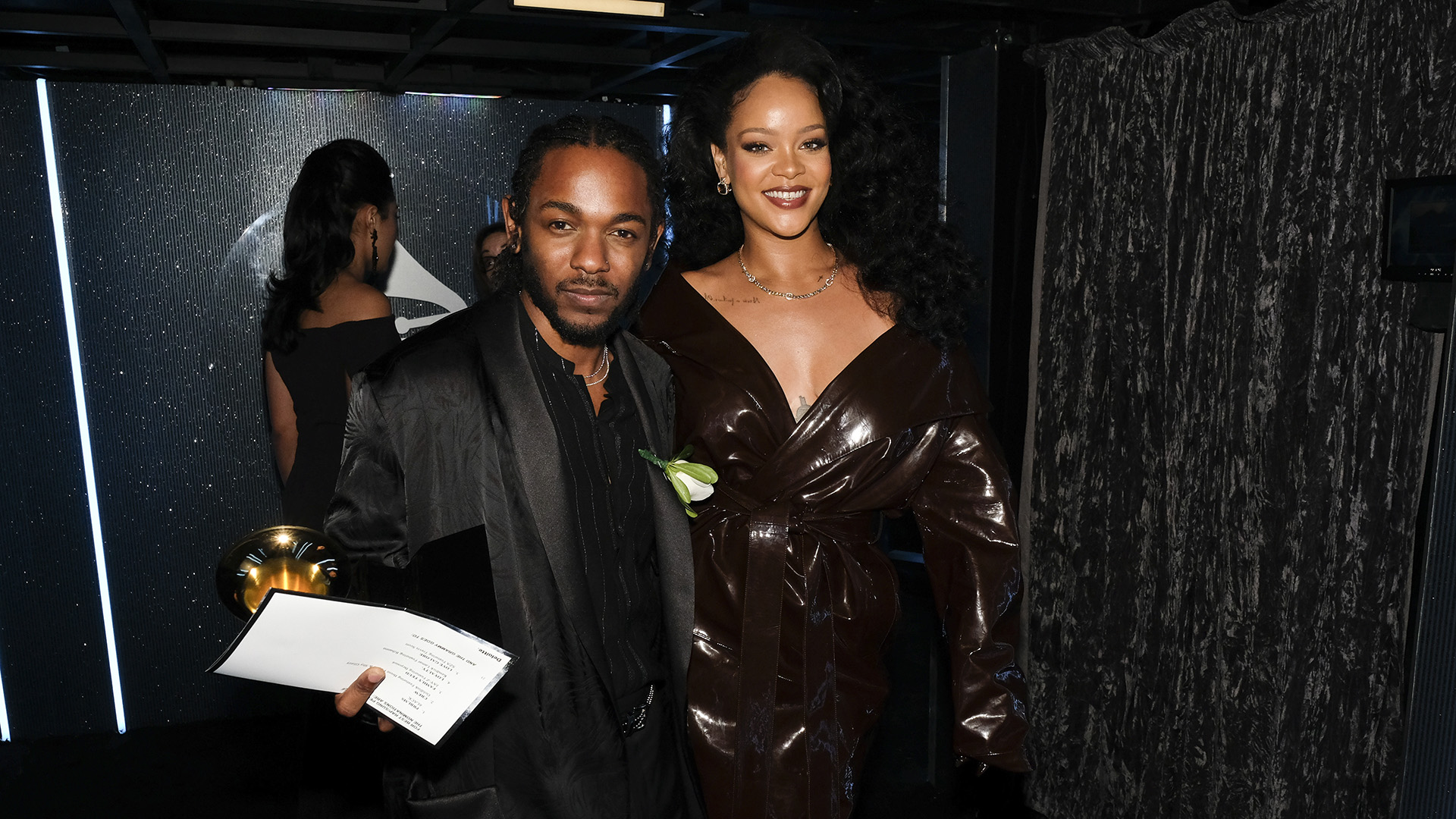 Hip-hop figurehead Kendrick Lamar walks backstage with R&B/pop superstar Rihanna after accepting a trophy for Best Rap/Sung Collaboration.