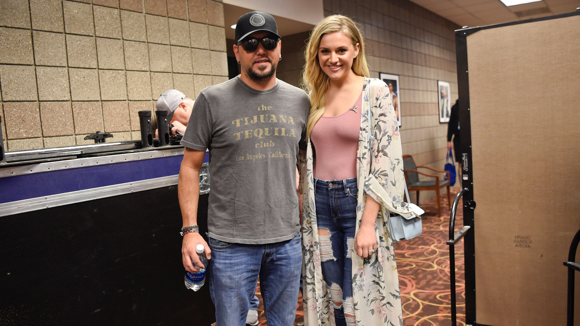 Jason Aldean poses with Kelsea Ballerini backstage in between run-throughs for Sunday's show.