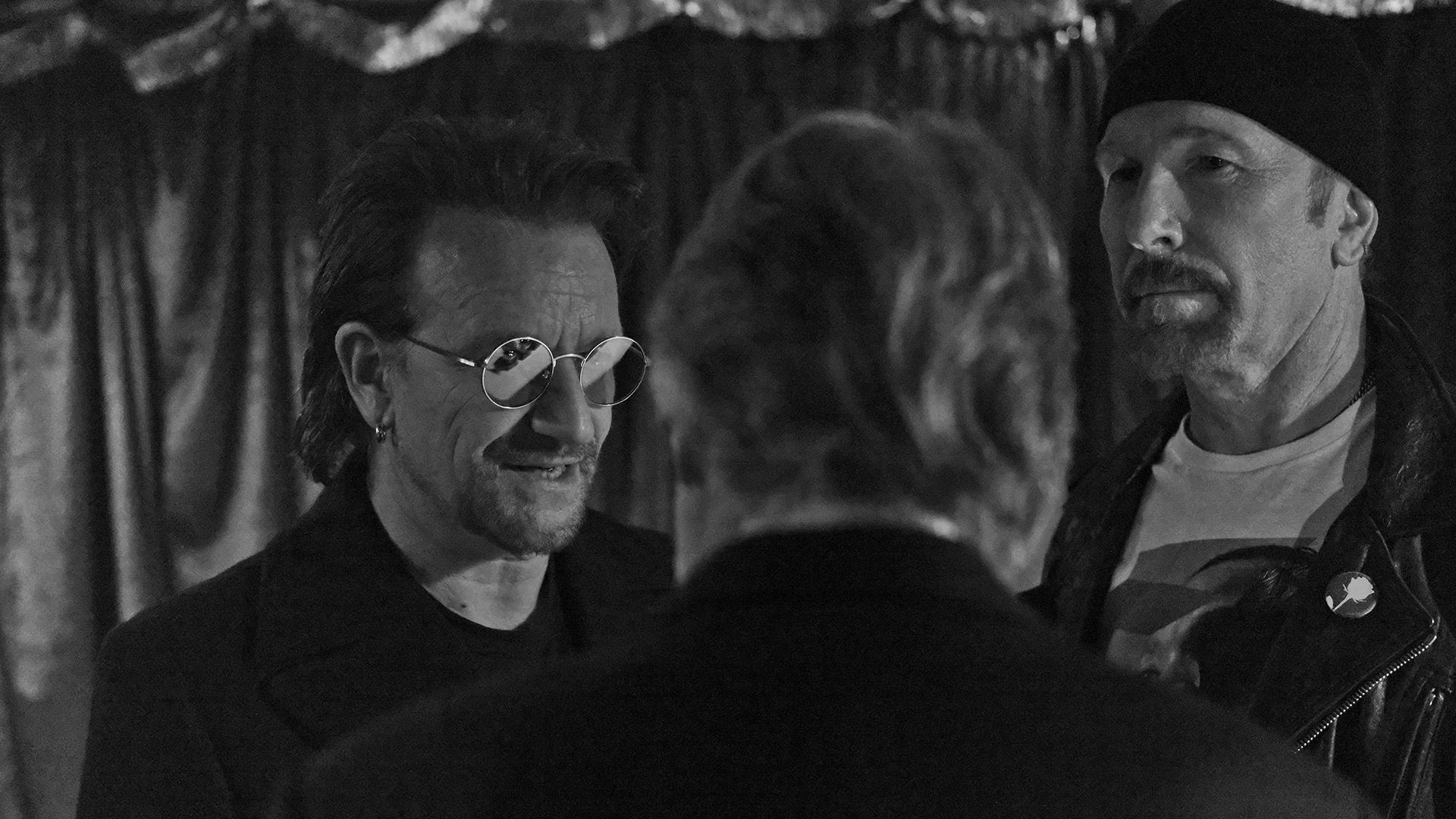 Irish rock legends Bono and The Edge pause to confer backstage in between performances at the 60th Annual GRAMMY Awards. 