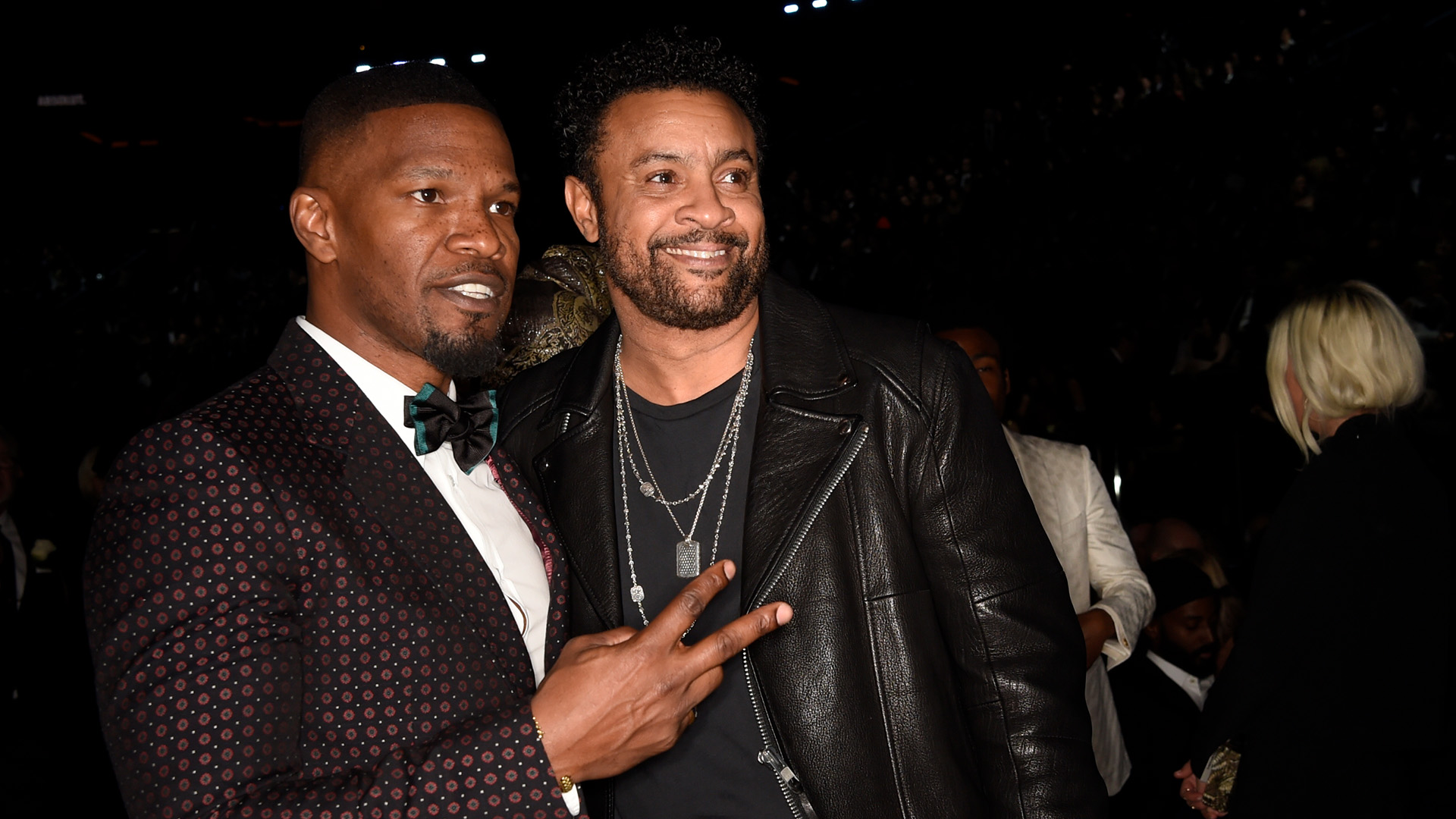 Actor Jamie Foxx throws up a peace sign alongside 60th Annual GRAMMY Awards performer Shaggy.