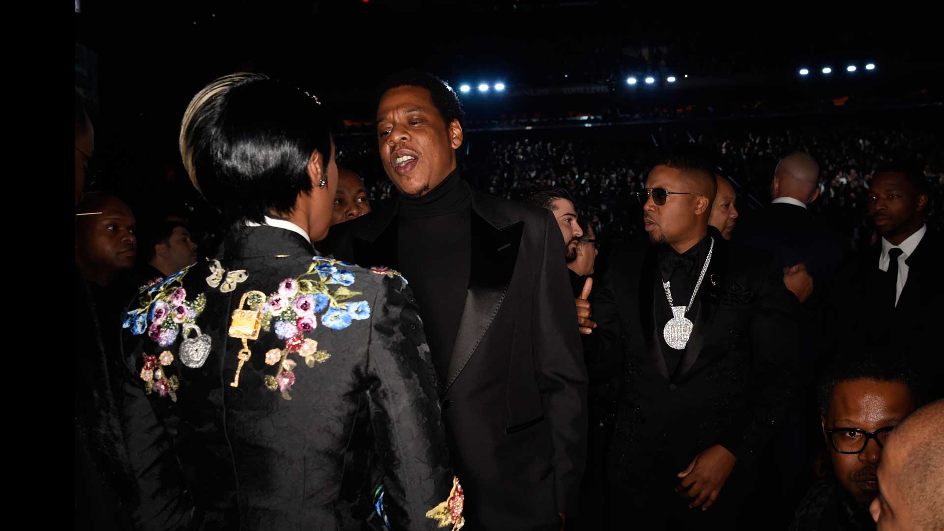 Janelle Monáe chats it up with JAY-Z amidst the 60th Annual GRAMMY Awards audience.