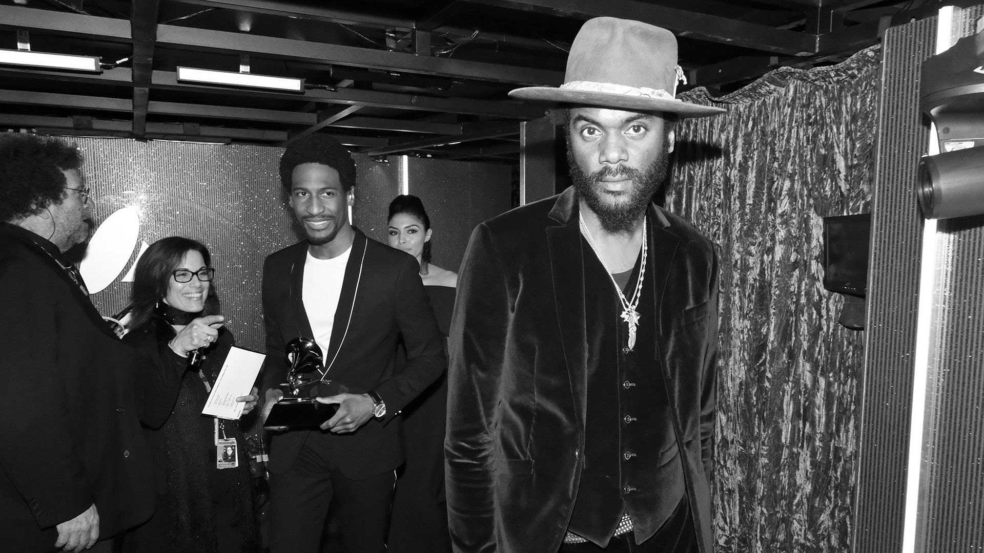 Presenters and performers Gary Clark Jr. and Jon Batiste walk backstage after accepting Ed Sheeran's GRAMMY for Best Pop Solo Performance.