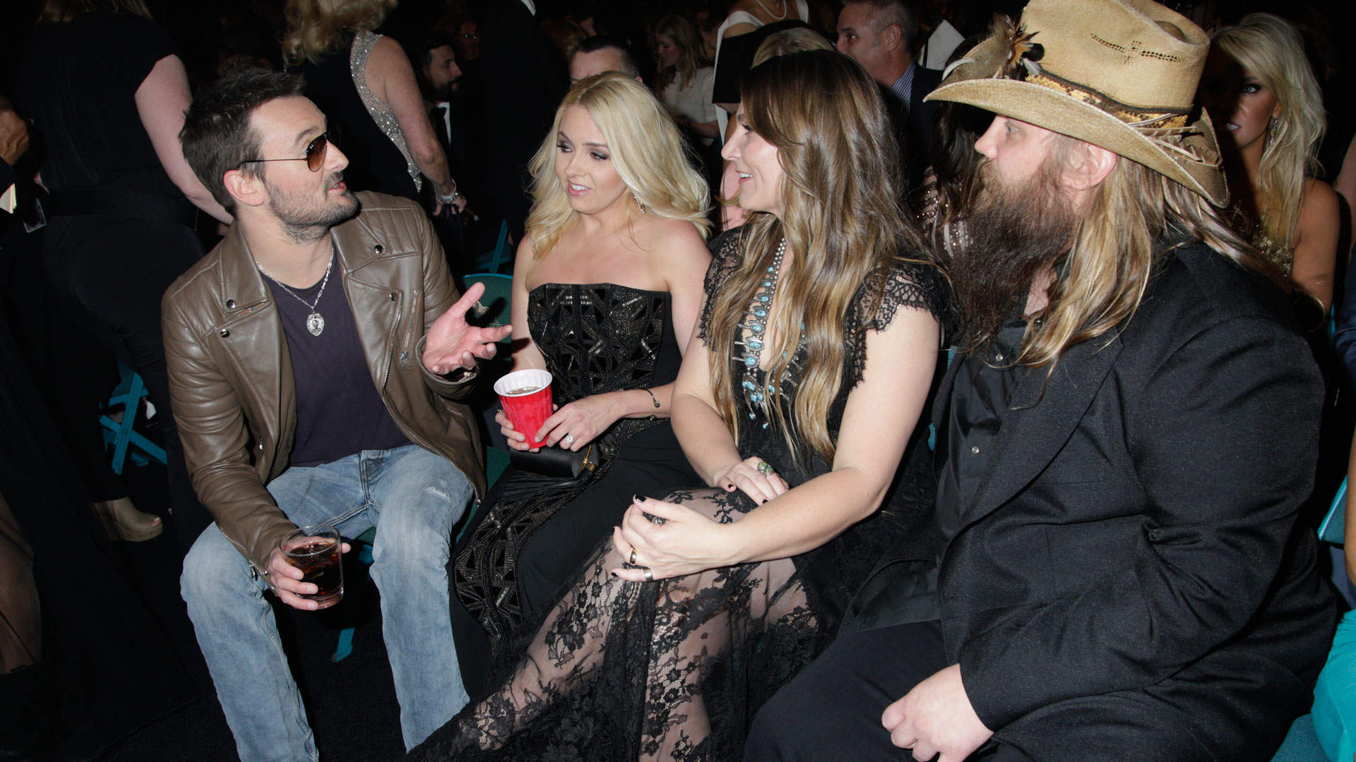 Eric Church and his wife chat with Chris and Morgane Stapleton during a commercial break.