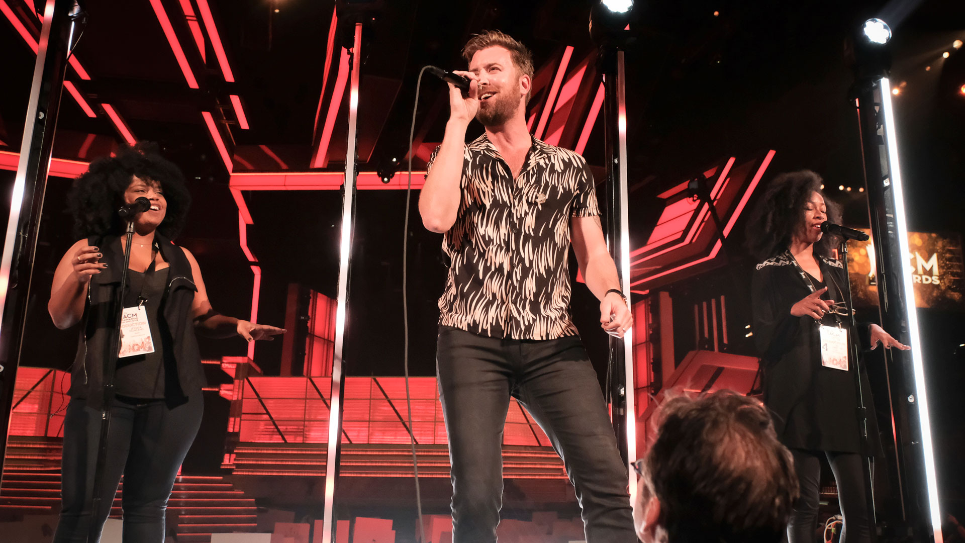Charles Kelley has a great time while his back-up dancers boogie down behind him.