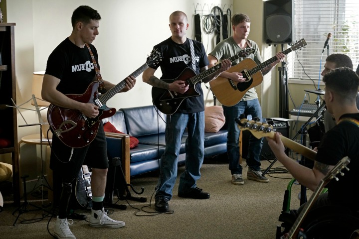 The band featured in the episode is the real MusiCorps Wounded Warrior Band.