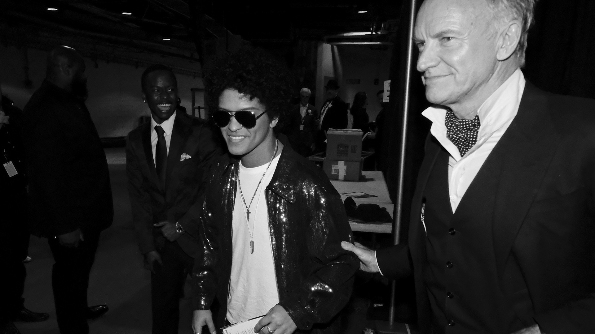 Bruno Mars, who took home multiple golden gramophones during the 60th Annual GRAMMY Awards, hangs backstage with Sting. 