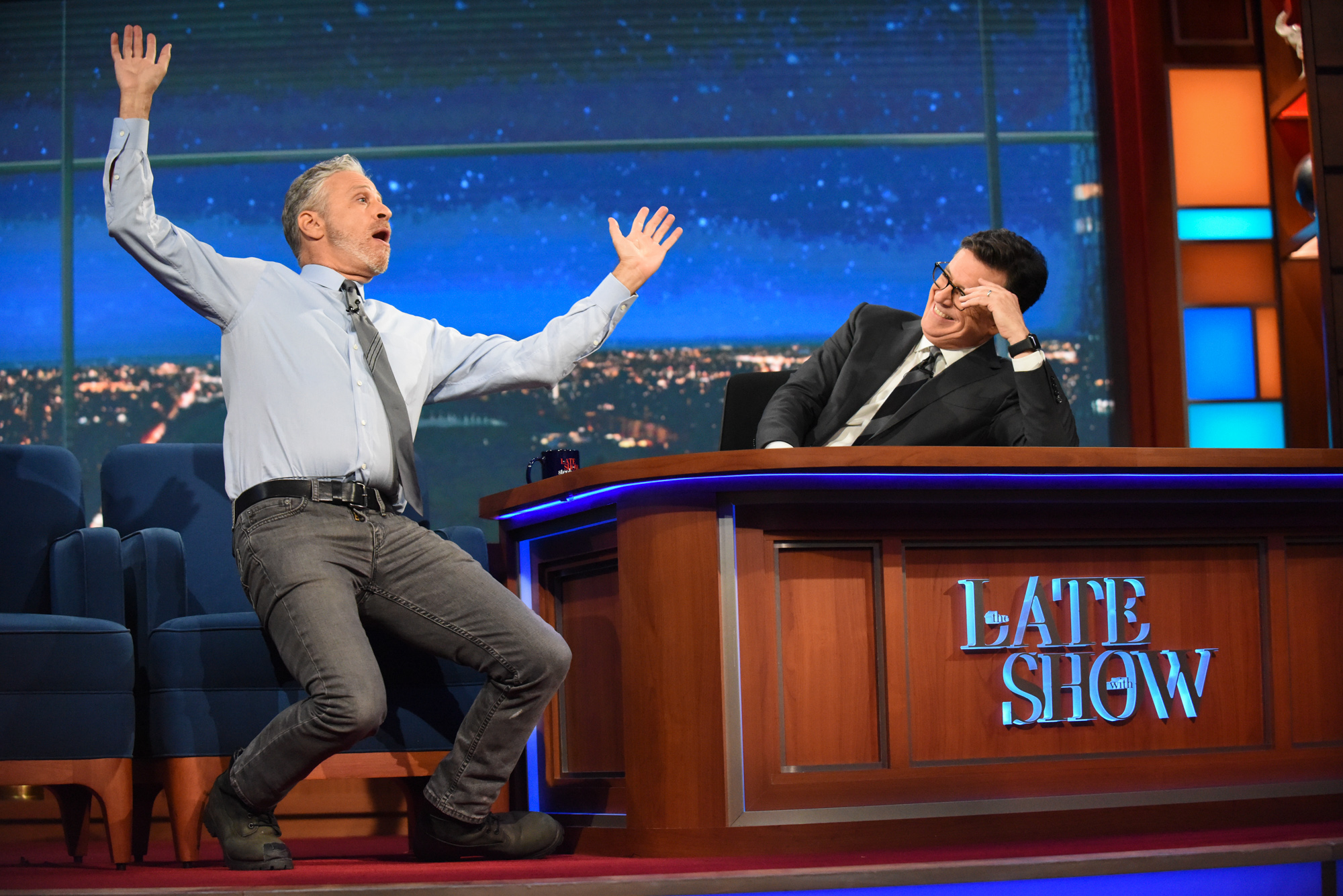 Jon Stewart struggles to get comfortable on the other side of the desk.