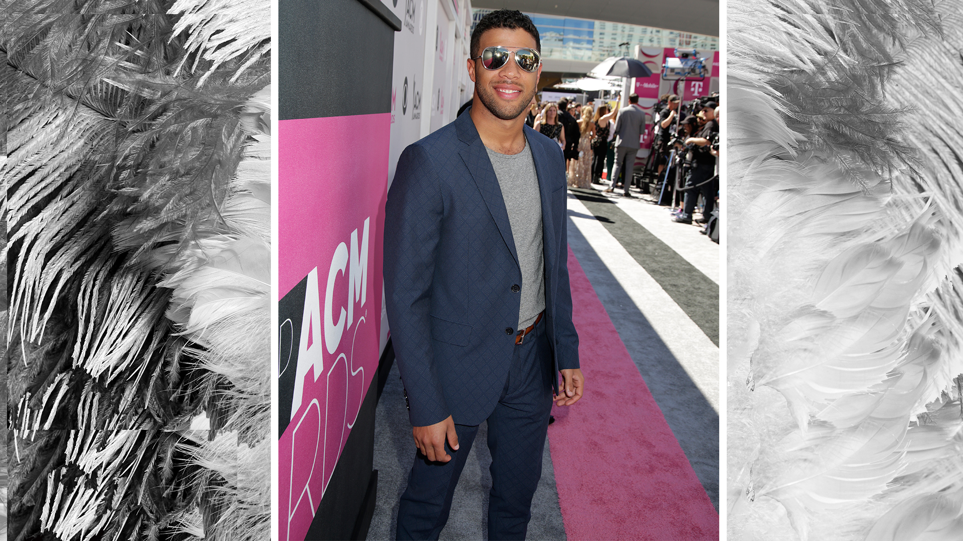 NASCAR driver Bubba Wallace keeps it cool in aviator sunglasses and a crewneck tee.
