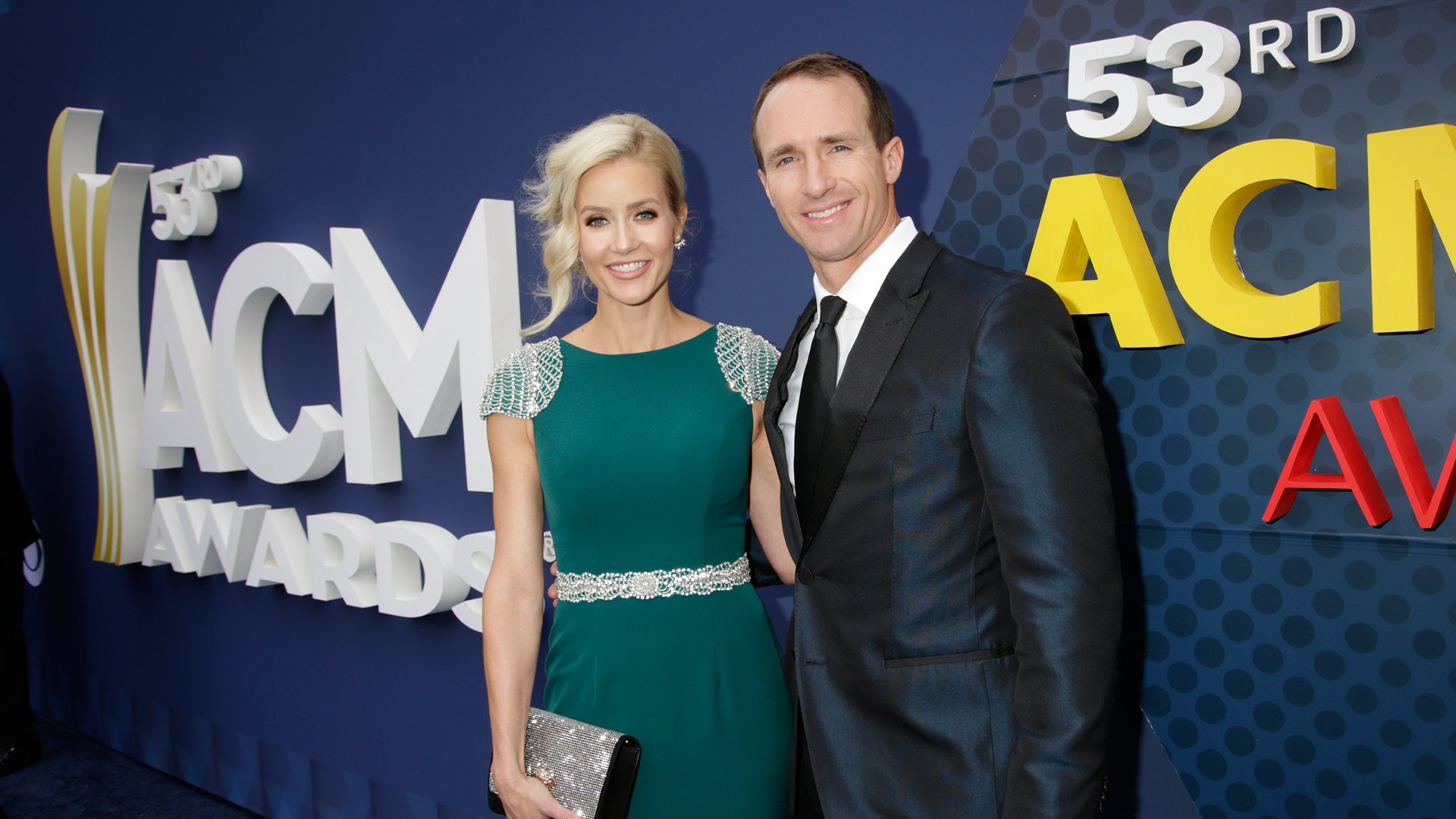 Football player Drew Brees cuddles close to his wife Brittany before heading into MGM Grand Garden Arena.