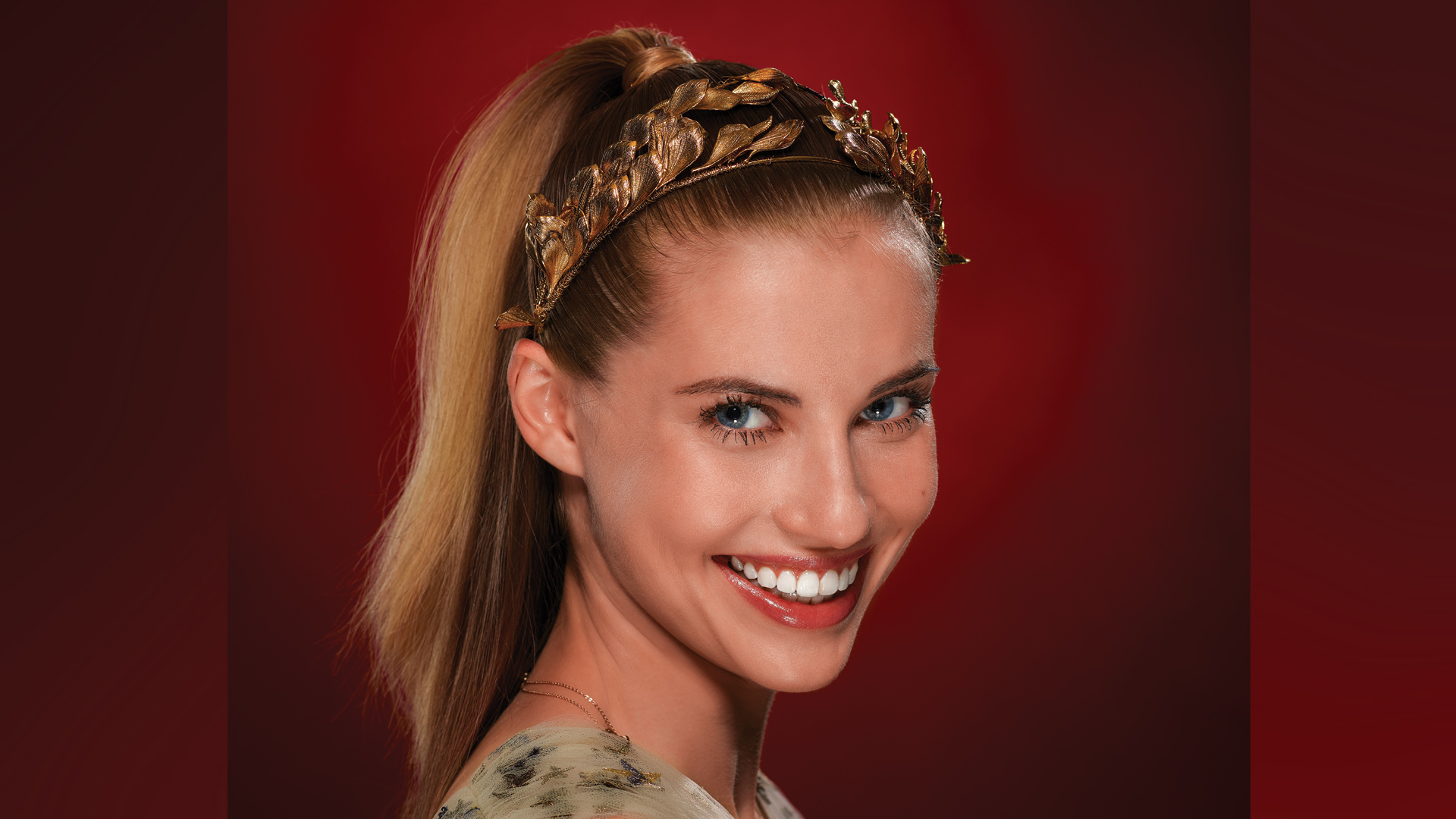 Wallis Currie-Wood adds festive sparkle and head bling to her hairstyle.