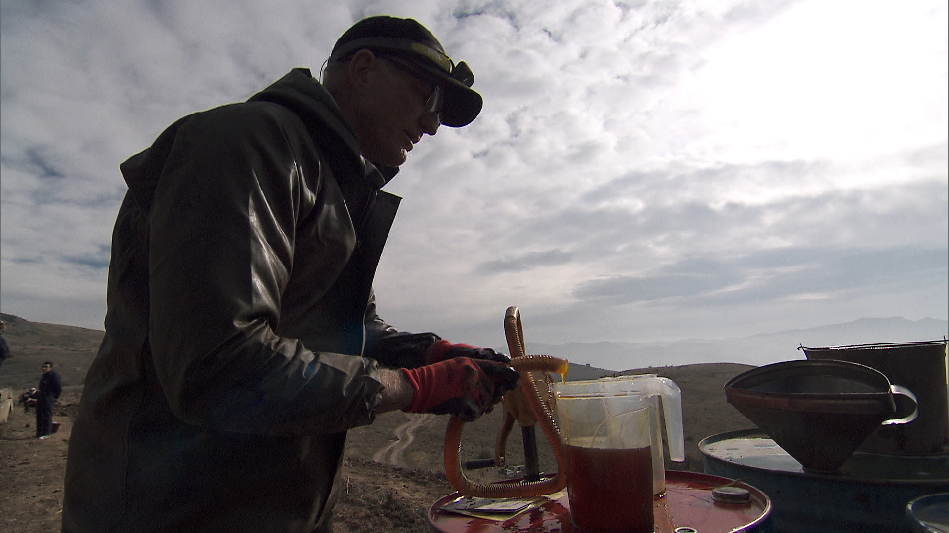 Scott tries his hand at changing the oil in a Lada taxi.